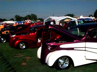 <row of hotrods and street rods>
